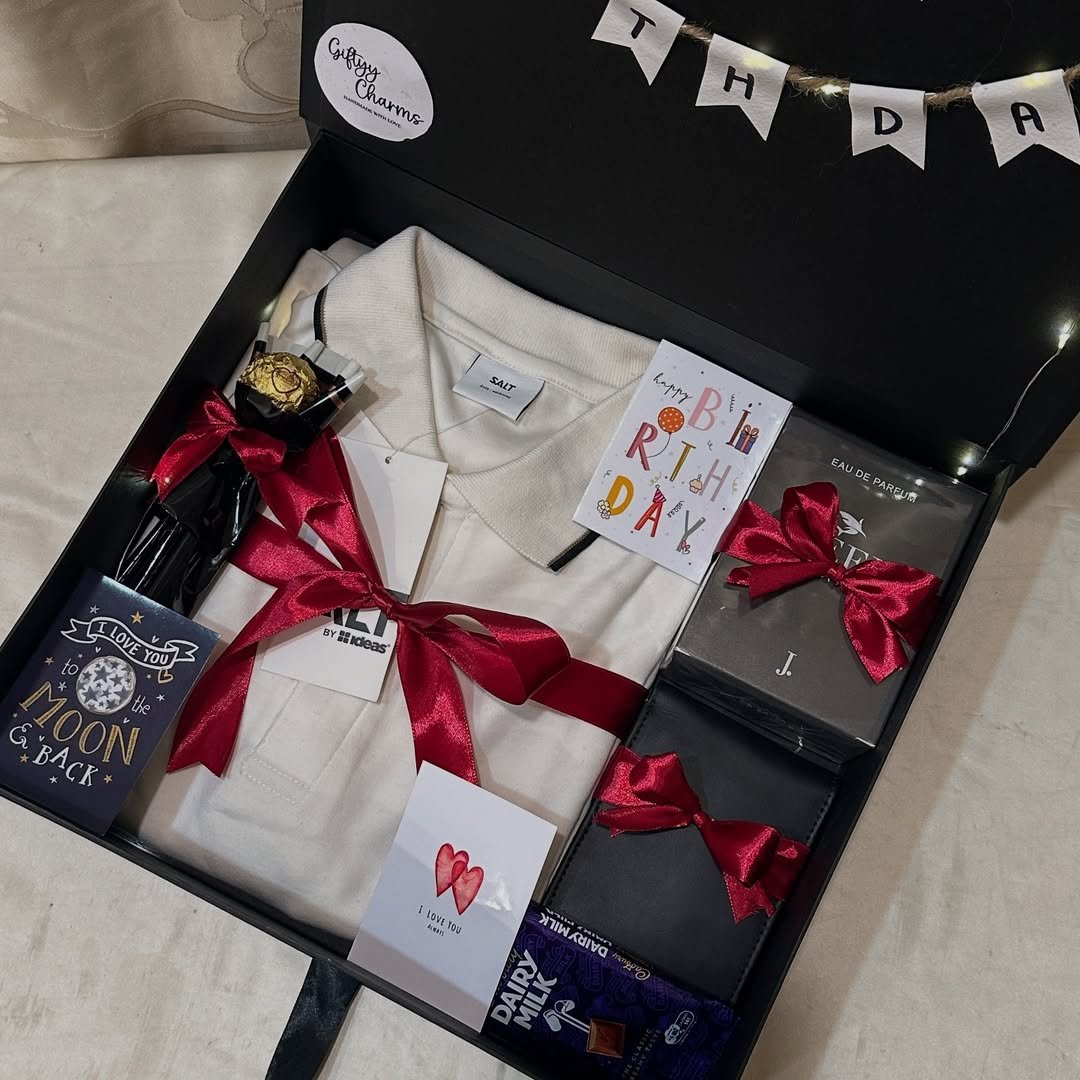 Premium birthday gift hamper with white T-shirt, perfume, chocolates and greeting cards